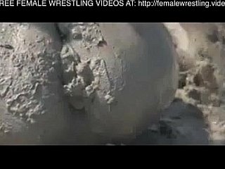 Girls wrestling in the mire
